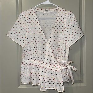 patterned v neck top that ties in the front